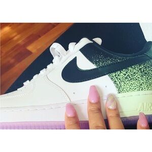 Nike Women's White and Black Sneakers with Green Accents